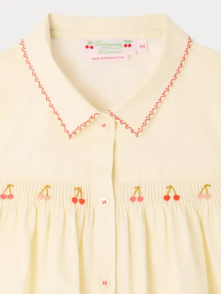 Lexi smocked and hand-embroidered blouse in organic cotton