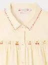 Lexi smocked and hand-embroidered blouse in organic cotton